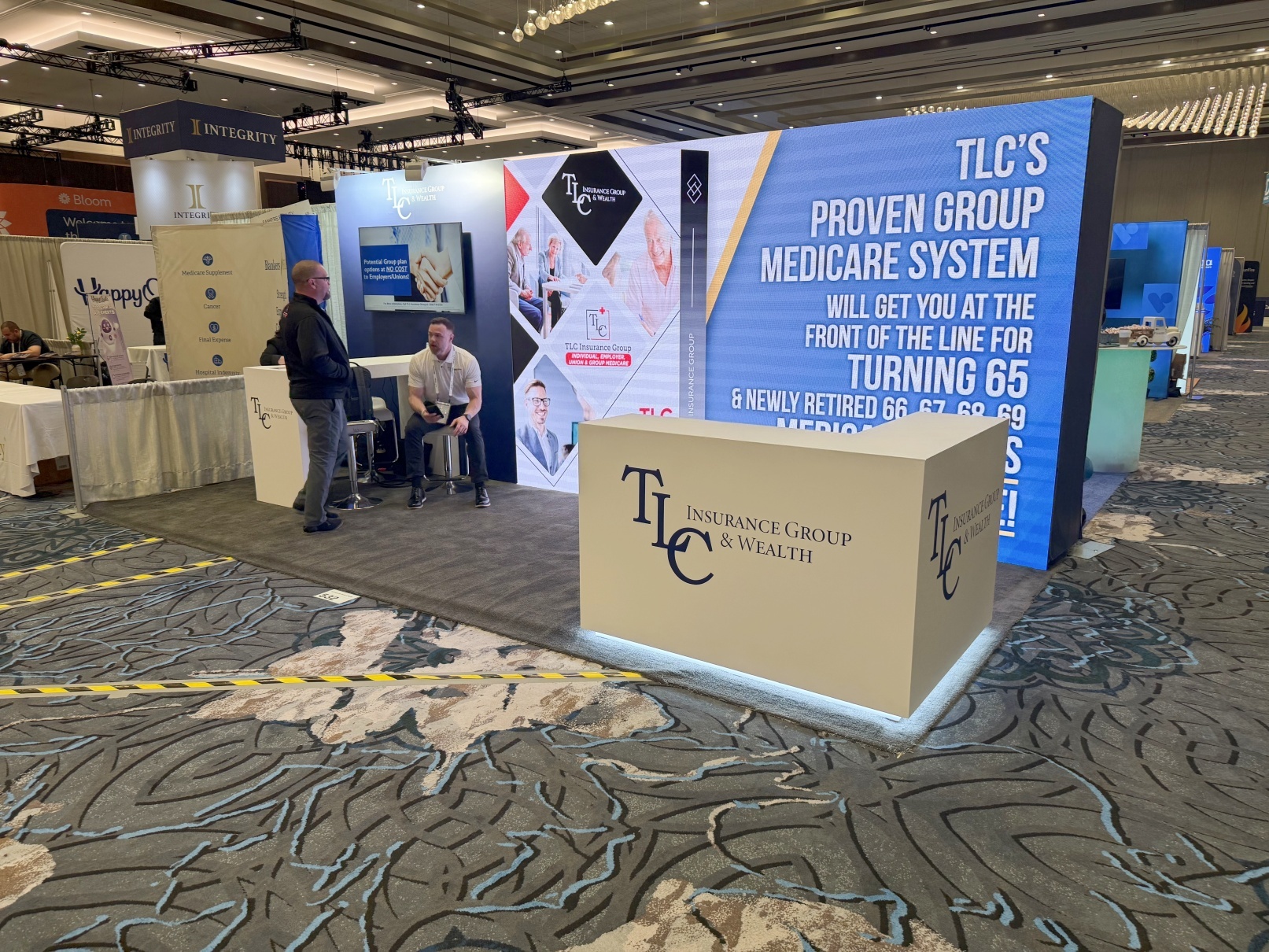 TLC Insurance Group 10′ x 20′ Medicarians LED Video Wall Booth